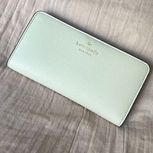 Kate Spade Bailey Large slim bifold wallet in Parchment NWT
